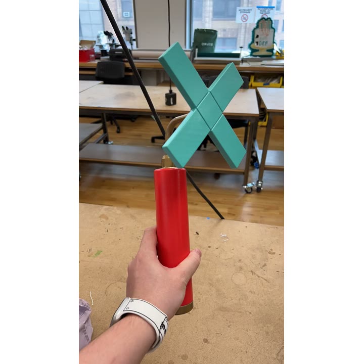 The finished Chill-out Stick held by its red handle